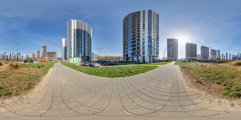 hdri panorama 360 near skyscraper multistory buildings of residential quarter complex with tower cranes in full equirectangular seamless spherical projection - 783214654