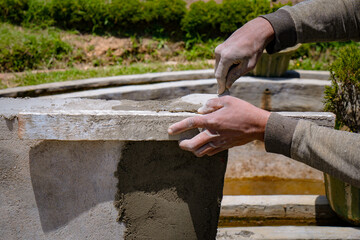 hand of worker plastering cement
