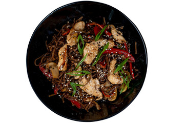Asian wok noodles with chicken and vegetables with chopsticks on the table. - 783220092