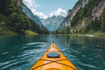 View from a kayak on a serene lake with mountains in the distance.
