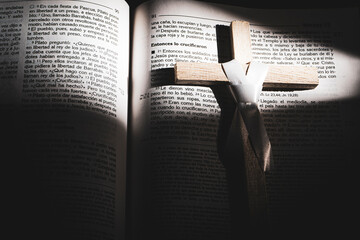 Medellin, Antioquia, Colombia. April 09, 2023. Wooden cross on the bible 