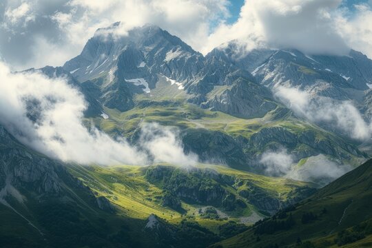 Scenic mountain range landscape with blue sky, clouds, and lush greenery beneath