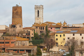 Traditional baix emporda village of Cruilles. Tower and church. Spain