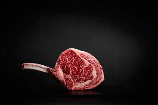 Wagyu beef on the bone on black slate