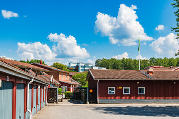 Garages and Red Building With Flag in Mölndal, Sweden