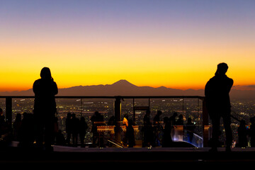 Sunset silhouettes at city viewpoint