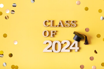 Golden glitter number 2024 with graduated cap. Class of 2024 concept.