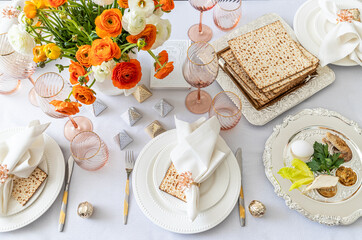 A Passover table setting with a floral centrepiece