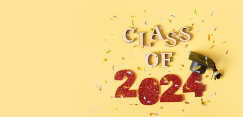 Class of 2024 banner concept. Red number 2024 with graduated cap and confetti top view
