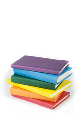 Book stacking. Open book, hardback books on white background. Back to school. Copy space for text.
