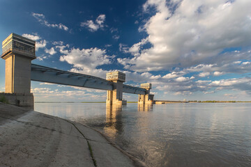 Hydraulic structure, a dam through which a river flows, made of concrete and metal. Astrakhan,...