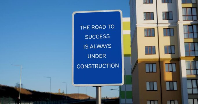 The Road To Success Is Always Under Construction Road Sign on Clear Blue Sky