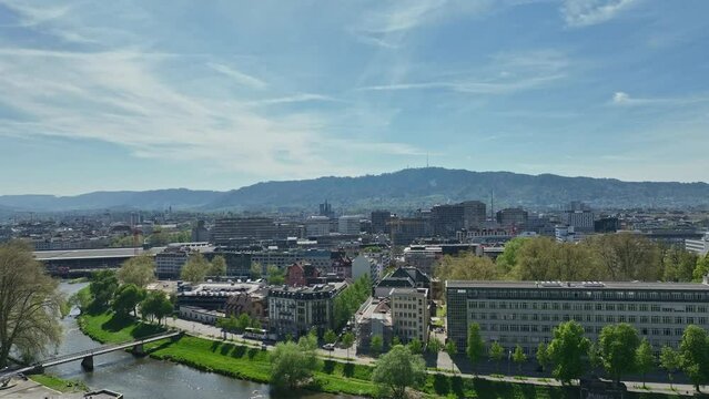 Aerial view over Swiss City of Z&uuml;rich with Sihl River and railway station on a sunny spring afternoon at Swiss City of Z&uuml;rich. Movie shot April 12th, 2024, Zurich, Switzerland.