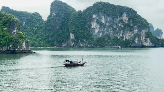 Sailing with a boat in Halong Bay, Vietnam