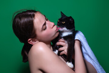 Kitty with kissed girl. Cat and woman face. Pretty girl kiss The fluffy black cat. Cute cat and beauty woman kissing. Love cat.