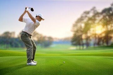 Golfer driver back swing before hitting golf ball down the fairway.