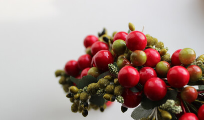 Artificial Branch With Red And Green Berries On White Background Stock Photo For Greeting Cards Or Titles 