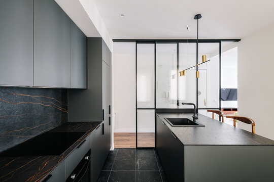 Fototapeta Interior of modern and sober kitchen