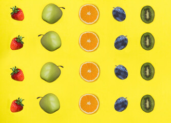 Fruit and berry on the yellow background. Flat lay. Pattern.