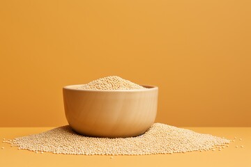 Scattered sesame grains in bowl with copy space for text, top view
