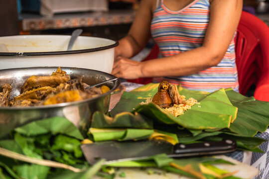 Authentic Woman Preparing Traditional Peruvian Food in her Kitchen