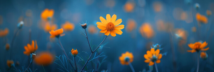 Golden wildflowers shine with a soft glow against the twilight blues, evoking a serene and contemplative mood