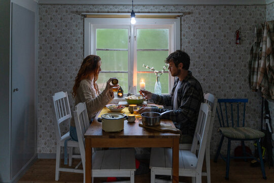 Couple eats dinner at home