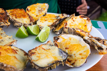 Grilled oysters, seafood, cheese gastronomy, restaurants