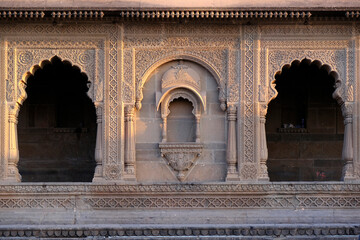 24 February 2024, Exterior View of the scenic tourist landmark Maheshwar fort (Ahilya Devi Fort ) in Madhaya pradesh, India, Beautiful sculptures Carving details on the outer wall.