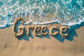 Greece written in the sand on a beach. Greek tourism and vacation background
