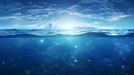 underwater view of the sea surface against a blue sky and sunbeams. superior quality image Underwater scene on the surface of the sea and sun beams. High-quality picture of a divided underwater scene 