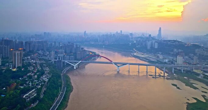 Aerial view of river with bridge and city skyline in Chongqing