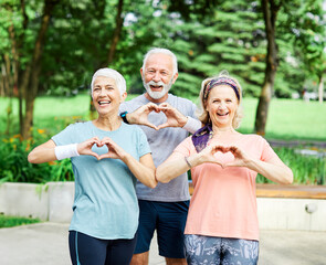 outdoor senior fitness woman man lifestyle active sport exercise healthy fit retirement heart shape