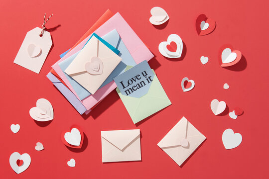 Valentine's day festive composition with paper white and red hearts