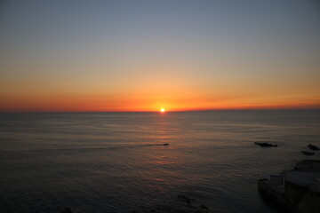 sunset over the sea with cloudy sky	, landscapes