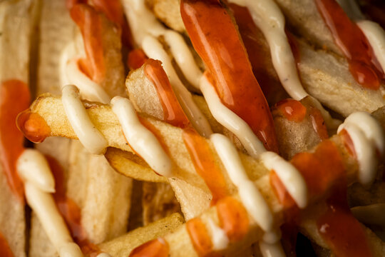 French fries with sauces on top
