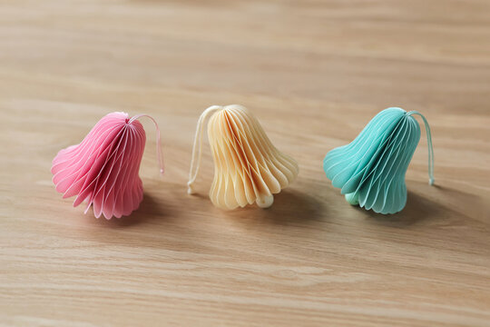 Set of multicoloured honeycomb bells from accordion folded paper 