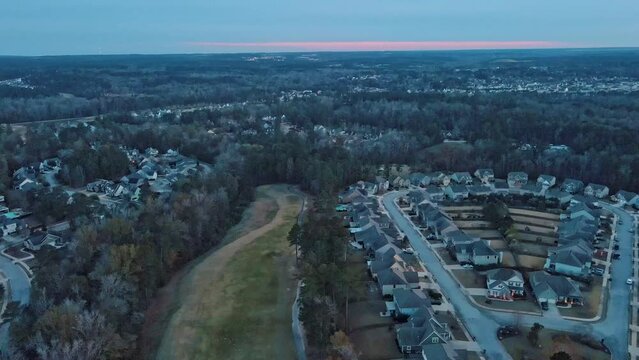 Aerial sunset landscape of forest and suburban neighborhood in Evans Augusta Georgia