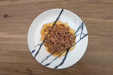 Food for animals background. wet cat and dog food texture, pattern. Pet meal background close up. wet food for pet dogs and cats. Dried pet food top view. Granules of good nutrition for dogs and cats.