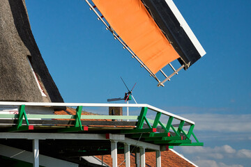 Traditional Dutch windmills turning, wind power renewable energy