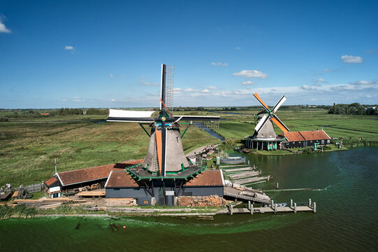 Sawmill windmill in Holland, miller rigs sail cloth on vane