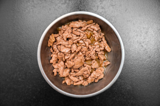Food for animals background. wet cat and dog food texture, pattern. Pet meal background close up. wet food for pet dogs and cats. Dried pet food top view. Granules of good nutrition for dogs and cats.