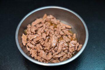 Food for animals background. wet cat and dog food texture, pattern. Pet meal background close up. wet food for pet dogs and cats. Dried pet food top view. Granules of good nutrition for dogs and cats.