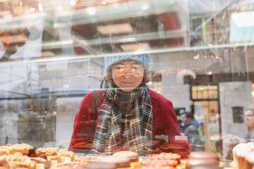Woman Gazing at Bakery Treats