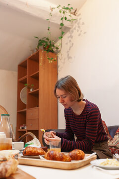 French Woman Eating Croissants