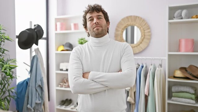 Confident man with beard standing arms crossed in modern wardrobe room, fashion, style, casual, interior, adult