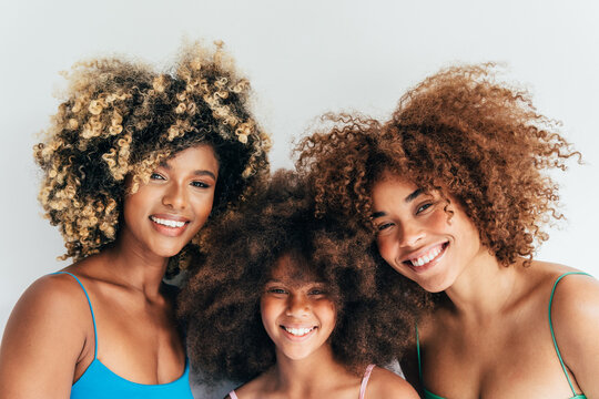 Beautiful smiling family showcasing natural curly hair