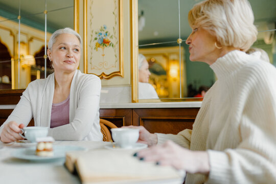 Meeting of two friends in a cafe