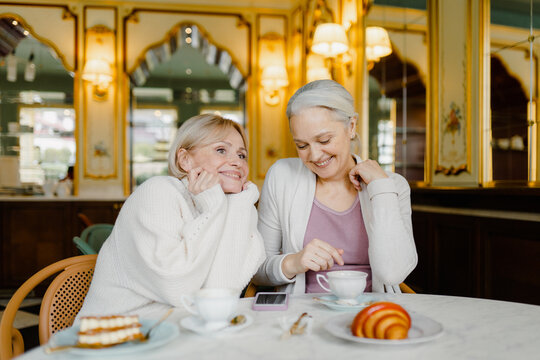 Meeting of two friends in a cafe