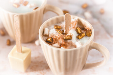 Cup of hot chocolate dipping sticks and marshmallows